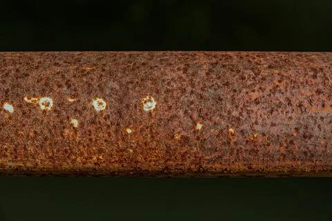 Heavy rust texture on horizontal iron pipe near midnight  Stock Photos