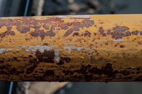 Heavy rust texture on industrial yellow pipe Фото
