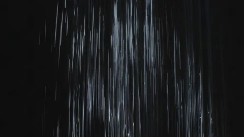 Heavy shower falling on black night background slow motion copy space text Stock Footage 130505838