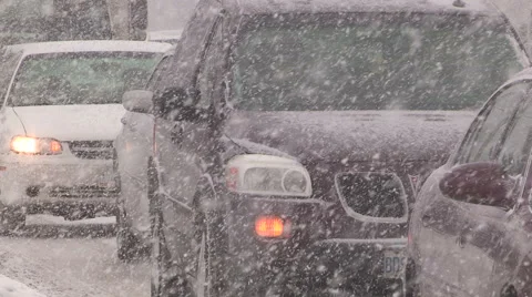 Heavy snow and traffic on record cold winter day in Kitchener Ontario Stock Footage 47042343