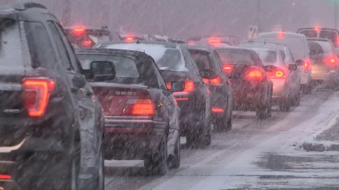 Heavy snow causing traffic jam and gridlock during winter storm Stock Footage 83351937