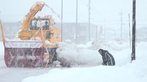 Heavy Snow Clearing Machine Plows Road In Blizzard Stock Footage 83613040