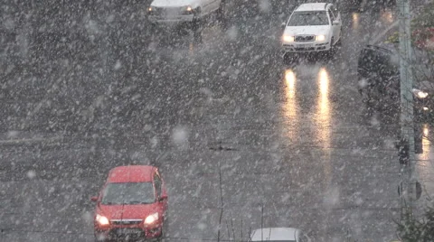 Heavy snow fall traffic car urban town winter season cloudy day dangerous road Stock Footage 43144086