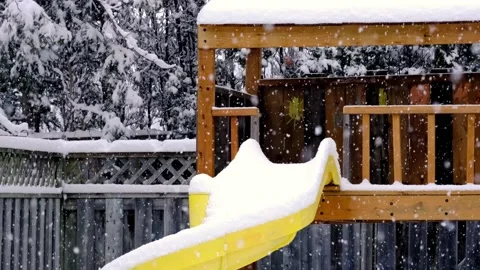 Heavy snow falling on backyard play structure Stock Footage 147101325