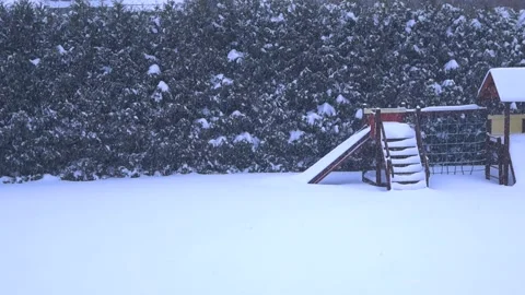 Heavy Snow Falling on an Empty Playground During a Winter Blizzard Stock Footage 335956014