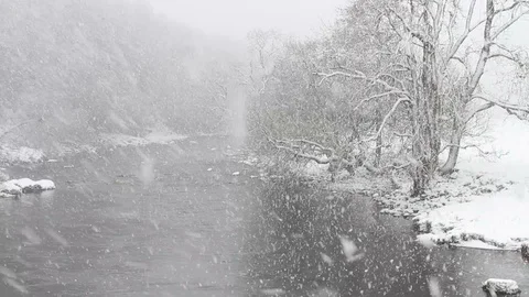 Heavy Snow Falling on the River Tees in Upper Teesdale County Durham UK Stock Footage 114893595