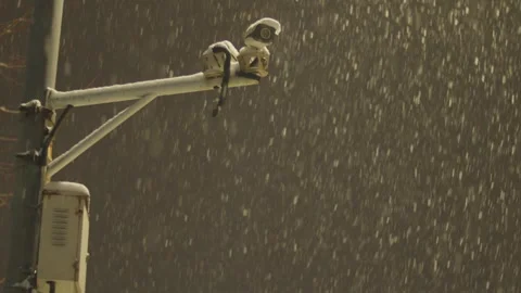Heavy Snow Falls on Security Cameras Mounted on Pole 動画素材 339066831