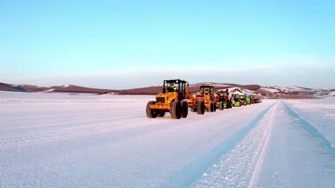 Heavy Snow Machinery Lined Up Beside a Cleared Winter Route Stock Footage 344955148