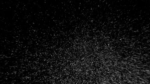 Heavy snow particles falling isolated on black background Stock Footage 125774446