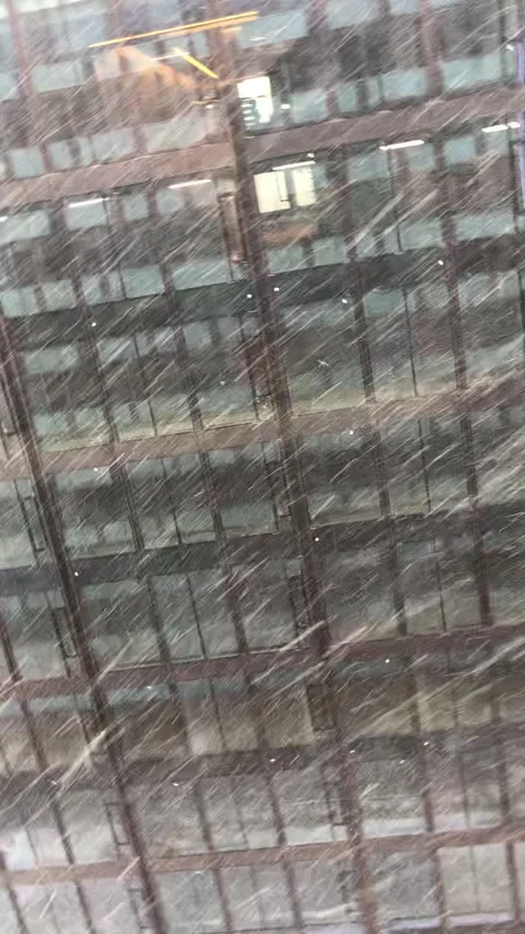 Heavy snowfall against a background of skyscrapers. Stock Footage 236925600