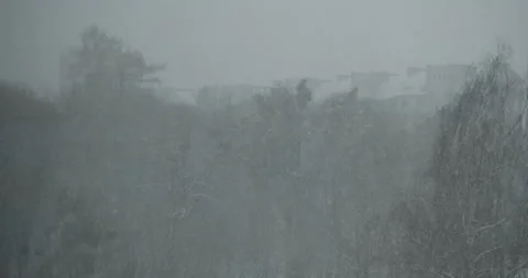 Heavy snowfall and poor visibility in the city Stock Footage 164642813