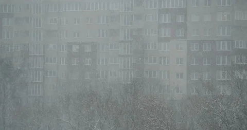 Heavy snowfall and poor visibility in the city Stock Footage 164642959