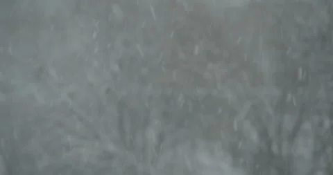 Heavy snowfall and poor visibility in the city Stock Footage 164643543