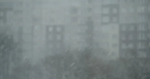 Heavy snowfall and poor visibility in the city Stock Footage 164643727