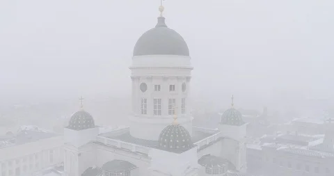 Heavy snowfall and wind around Tuomiokirkko in Helsinki Stock Footage 86320250