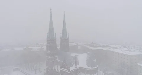 Heavy snowfall and wind around St. John's Church Stockbeeldmateriaal 86322676