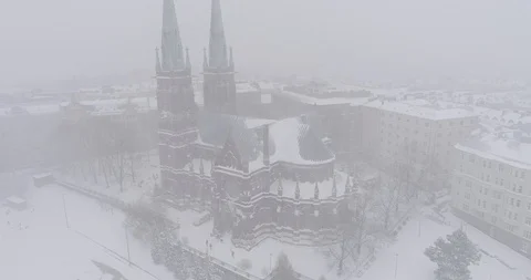 Heavy snowfall and wind around St. John's Church Stockbeeldmateriaal 86323495