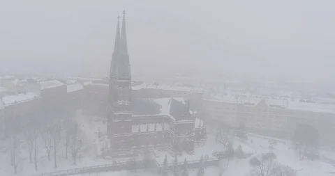 Heavy snowfall and wind around St. John's Church Stockbeeldmateriaal 86323638