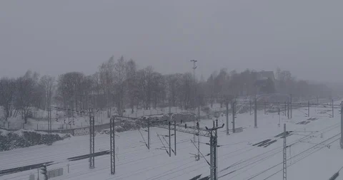 Heavy snowfall and wind around the railroad tracks in Helsinki Stockbeeldmateriaal 86329276