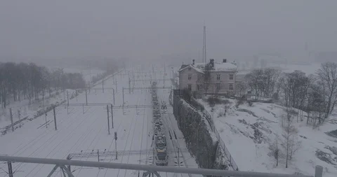 Heavy snowfall and wind around the railroad tracks in Helsinki Stockbeeldmateriaal 86330058
