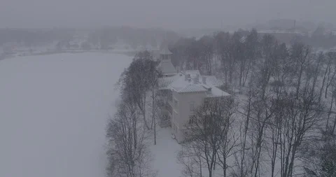 Heavy snowfall and wind around Linnunlaulun Huvila in Helsinki. Stock Footage 86330853
