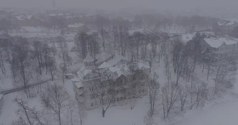 Heavy snowfall and wind around Linnunlaulun Huvila. Stock Footage 86331425