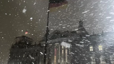 Heavy Snowfall Blankets Historic Building in Germany During Winter Night Stock Footage 314393148