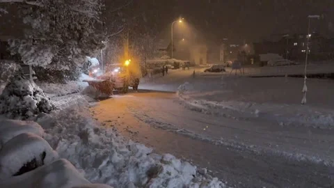 Heavy Snowfall in Buochs as Snowplow Clears the Streets Stock Footage 293097272