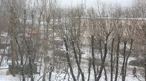 Heavy snowfall in the city in cloudy day Stock Footage 46276057