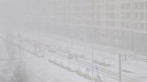 Heavy snowfall in the city Stock Footage 144977344