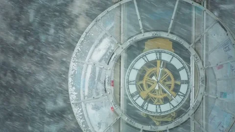 Heavy snowfall in the city.The town clock covered with snow. Stock Footage 69962166