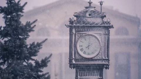 Heavy snowfall in the city.The town clock covered with snow. Stock Footage 69962287