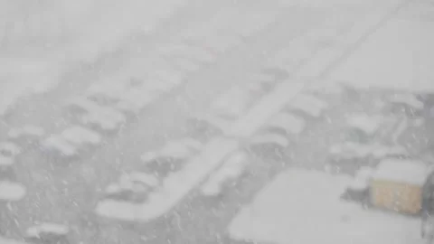 Heavy snowfall in the city from the window Stock Footage 130396377