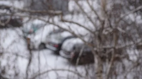 Heavy snowfall. Defocused parking area background. Stock Footage 67899692