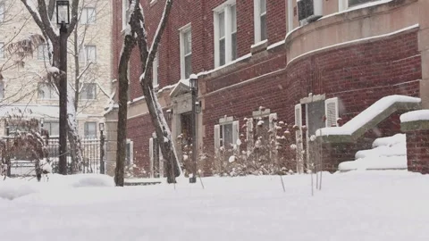 Heavy snowfall at the front of the apartment building  Urban Winter Scene Stock Footage 327635296