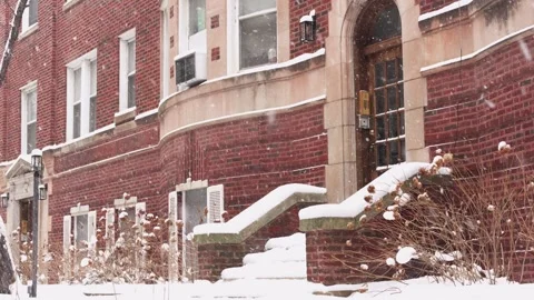 Heavy snowfall at the front of the apartment building entrance  Urban Winte.. Stock Footage 327635576