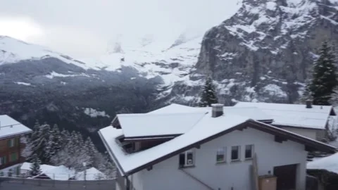 Heavy Snowfall Over a Quiet Mountain Village in Winter Stock Footage 327998439