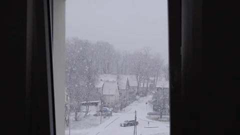 Heavy Snowfall Through a Window, Slow Motion Stock Footage 84913598