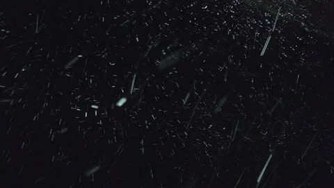 Heavy snowfall with wind at night illuminated by a street lamp. Stock Footage 120267355