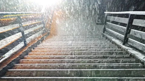 Heavy snowfall in winter. Snow falling on stairs at night time. Street light Video stock 132125693