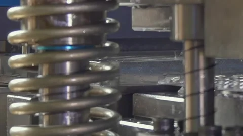 Heavy Steel Coil Compressing Rapidly Inside a Bright Industrial Factory Setting Stock Footage 340486430
