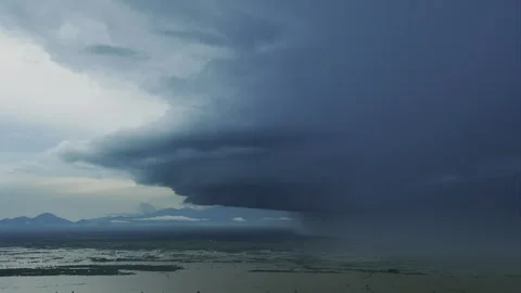 Heavy storm cloud approaching a flooded rural landscape 库存影片 331951743