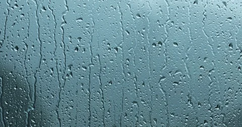 Heavy storm rain droplets flow on glass window Stock Footage 112154056