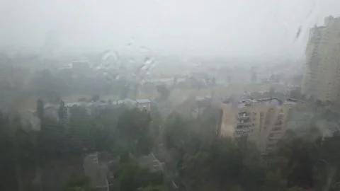 Heavy storm rain through window Stock Footage 111695729