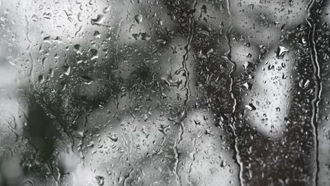 Heavy streams of rainwater running down a glass window Stock Footage 340834165