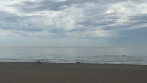 Heavy surf rolling past an empty lifeguard tower, Santa Monica Video stock 345266108