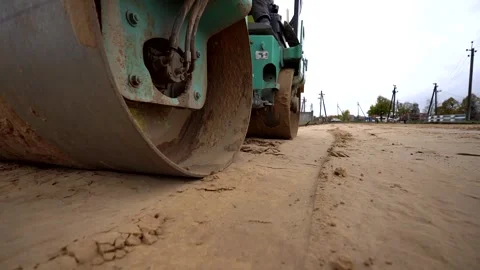 A heavy tractor compacting the soil Stock Footage 321826043