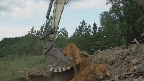 Heavy tractor working on construction site standing on debris heap Video stock 167179265