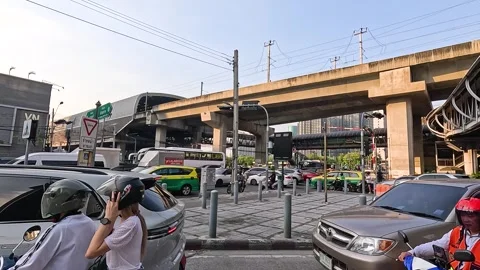 Heavy Traffic and Elevated Skytrain Infrastructure in Bangkok Thailand Stock Footage 327177045