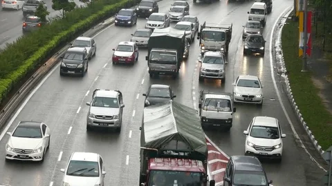 Heavy traffic drives through the rain Stock Footage 72358968